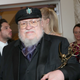 George R.R. Martin and his small golden friend